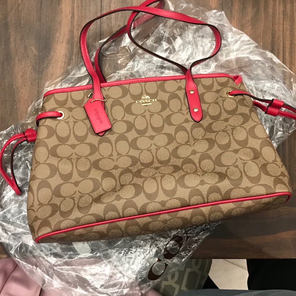 Brown and pink signature coach purse, used